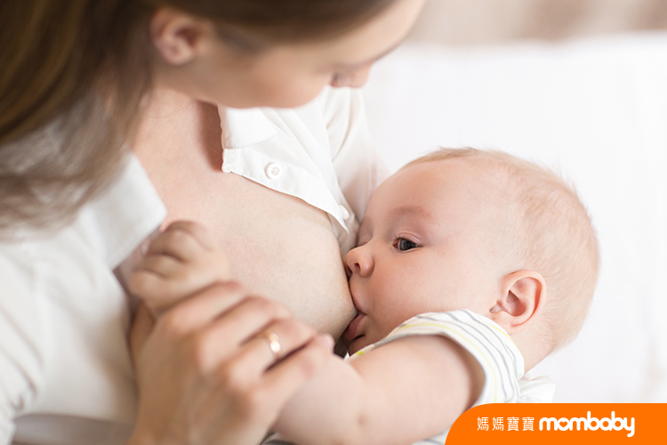 Young,Mother,Holding,Her,Newborn,Child.,Mom,Nursing,Baby.,Pretty