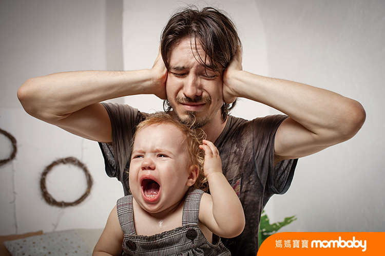 The child is screaming, hysterical. A tired dad doesn't want to hear the baby. The parent is irritated, tired, wants to take a break from his daughter. children's hysteria.