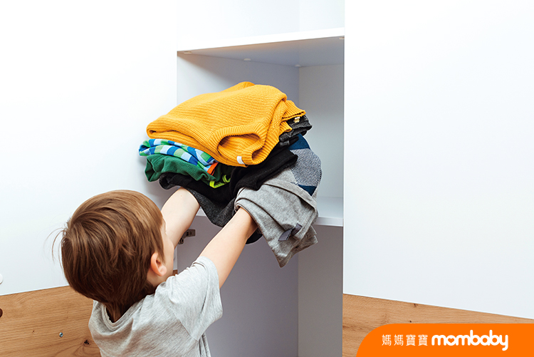 The,Boy,Puts,Things,In,Order,In,The,Closet.,A