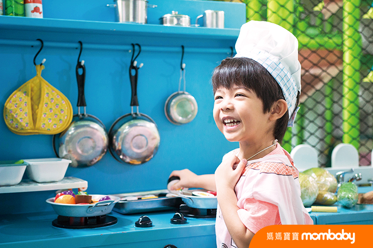 Little,Boy,In,Chef,Hat,And,Apron,Cooking,In,Toy
