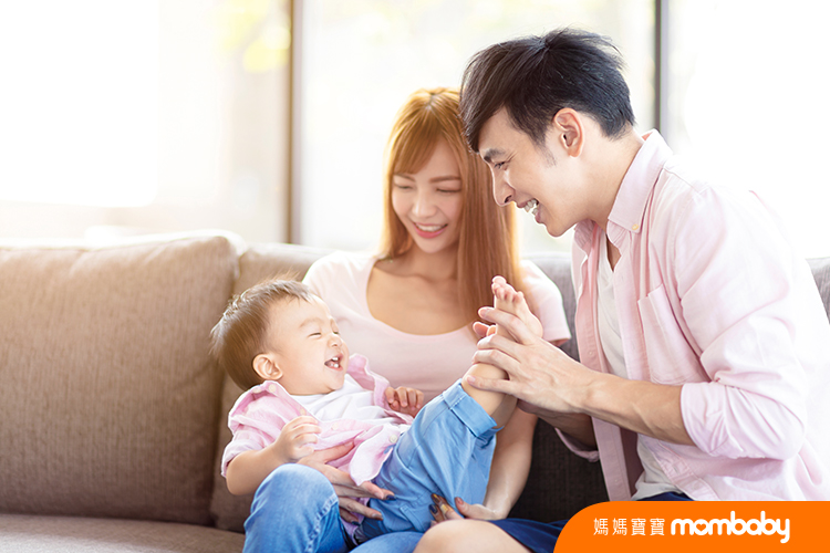 Happy,Family,Mother,And,Father,Playing,With,Baby,At,Home