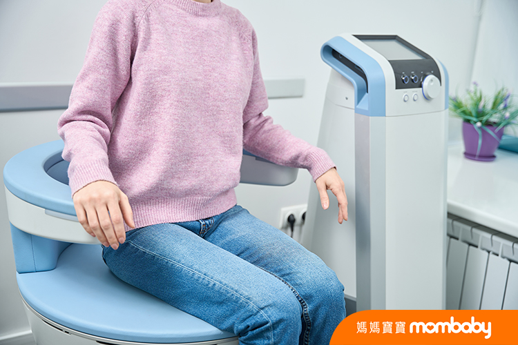 Woman,Sitting,On,Electromagnetic,Stimulation,Chair,Medical,Clinic